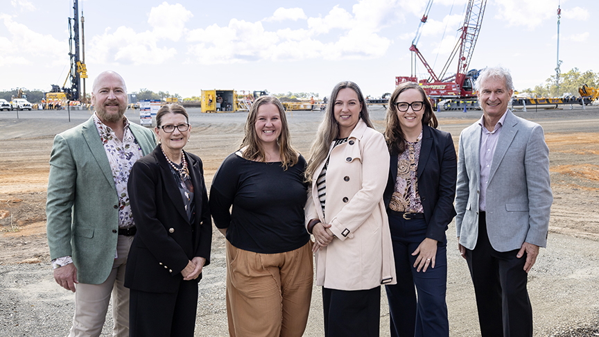 An image of a group of health staff and consumers standing at hospital construction site