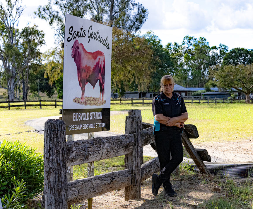 Woman standing next to Santa Gertrudis station at Eidsvold Station
