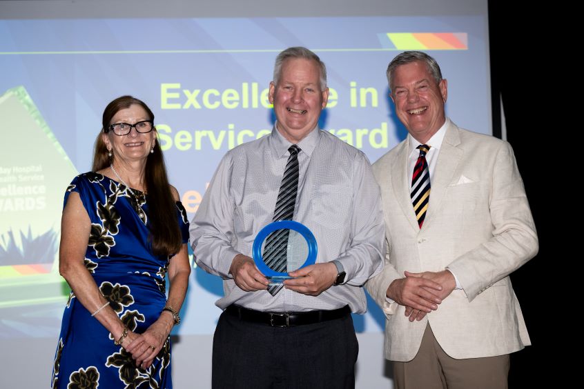Award recipient with Chief Executive and Health Minister