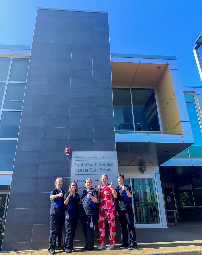Five female nurses standing in front of the Oral Health and Cancer Care Service Bundaberg Hospital