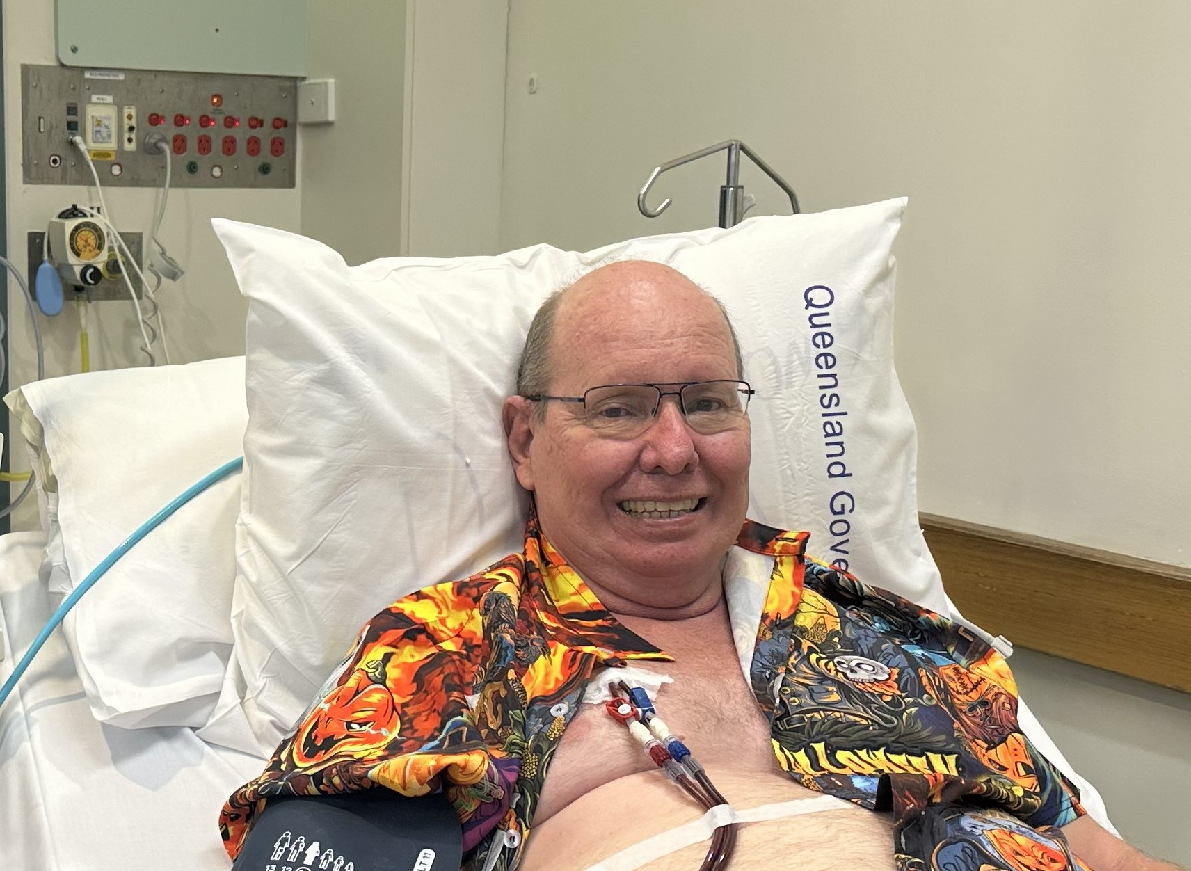 Renal patient in bed receiving treatment