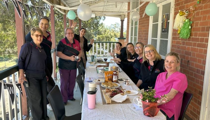 Group of nurses celebrating one of their team's award achievement