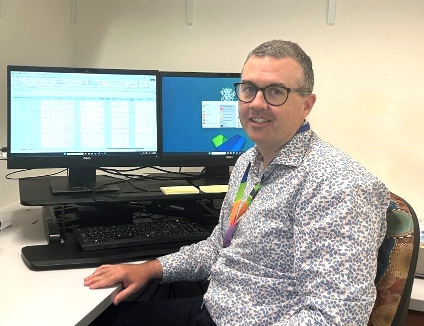 Office worker sitting at desk working at computer