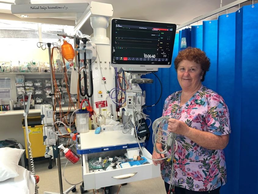 Female nurse standing in emergency treatment room