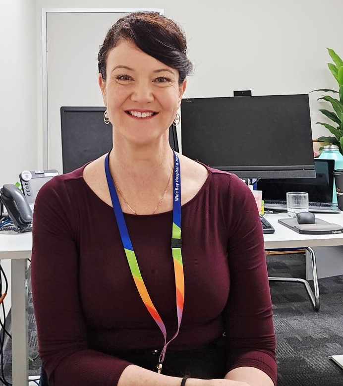 Hospital financial controller sitting at her workstation